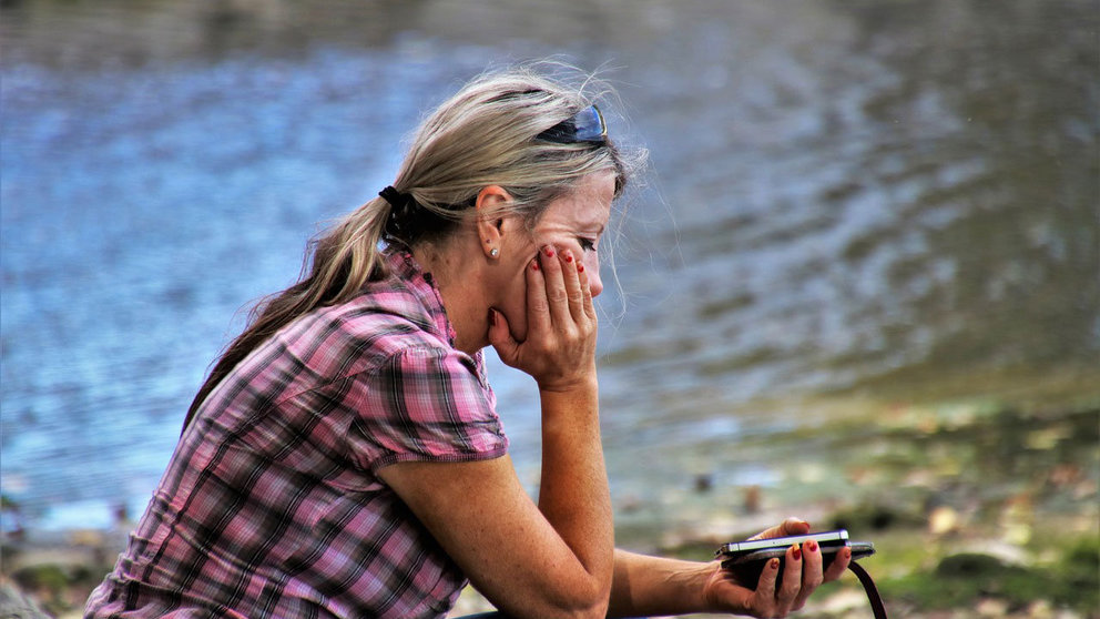 Woman sad lake