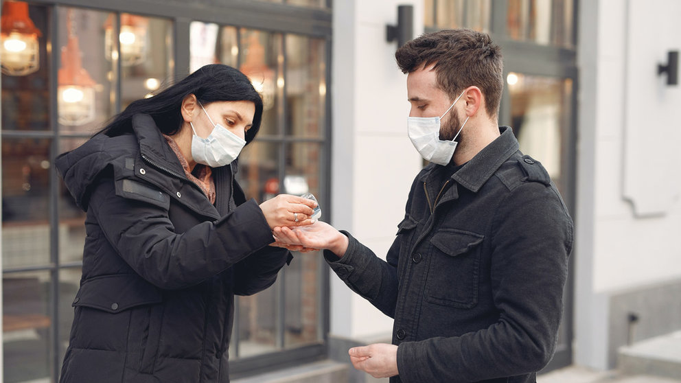 Woman-man-hand-sanitizer-mask-street-flu-influenza-ill-sick-disease