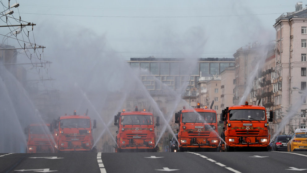 FILE PHOTO: Vehicles spray disinfectant while sanitizing a road amid the outbreak of the coronavirus disease (COVID-19) in Moscow, Russia May 16, 2020. REUTERS/Shamil Zhumatov
