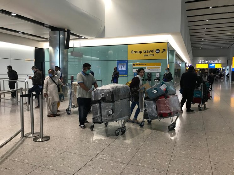 08 June 2020, England, London: People come into the arrivals lounge in Terminal 2 at Heathrow Airport, as new quarantine measures for international arrivals come into force amid the spread of the coronavirus pandemic. Photo: Steve Parsons/PA Wire/dpa