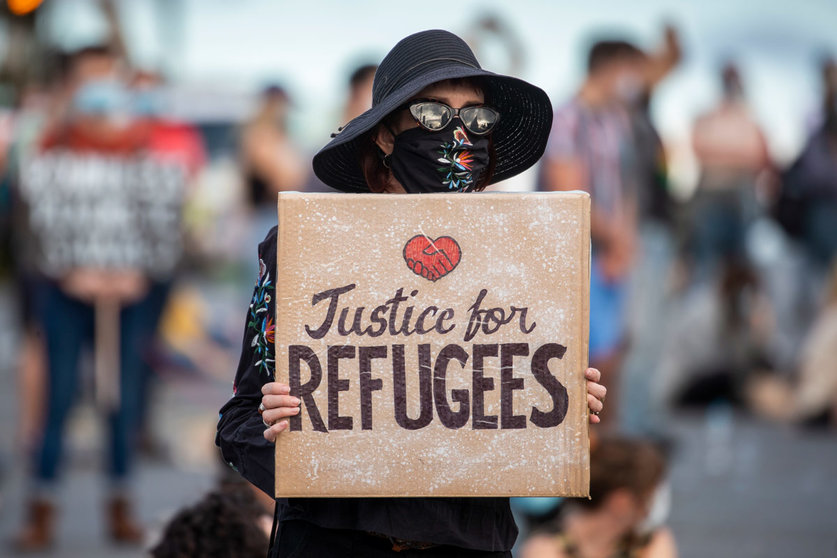Brisbane: A protester holds a placard as she takes part in a &#34;Free The Refugees&#34; rally at Kangaroo Point against the dismissal of asylum seekers. Photo: Glenn Hunt/AAP/dpa