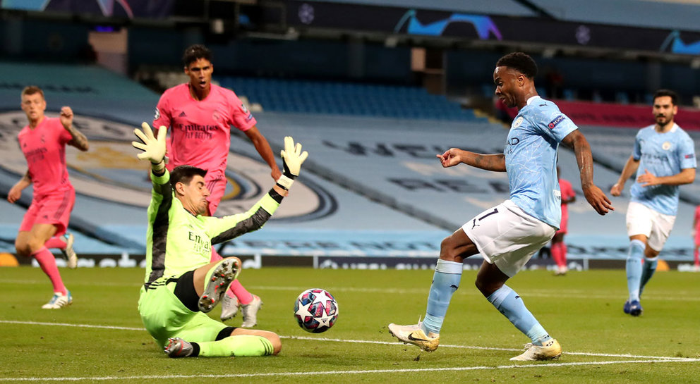 07 August 2020, England, Manchester: Manchester City&#39;s Raheem Sterling (R) has his shot saved by Real Madrid&#39;s Thibaut Courtois during the UEFA Champions League round of 16 second leg soccer match between Manchester City and Real Madrid at the Etihad Stadium. Photo: Nick Potts/dpa.