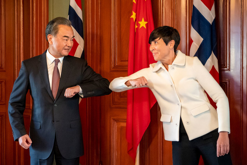 27 August 2020, Norway, Oslo: Norwegian Foreign Minister Ine Eriksen Soreide (R) greets Chinese Foreign Minister Wang Yi prior to their meeting. Photo: Heiko Junge/dpa.