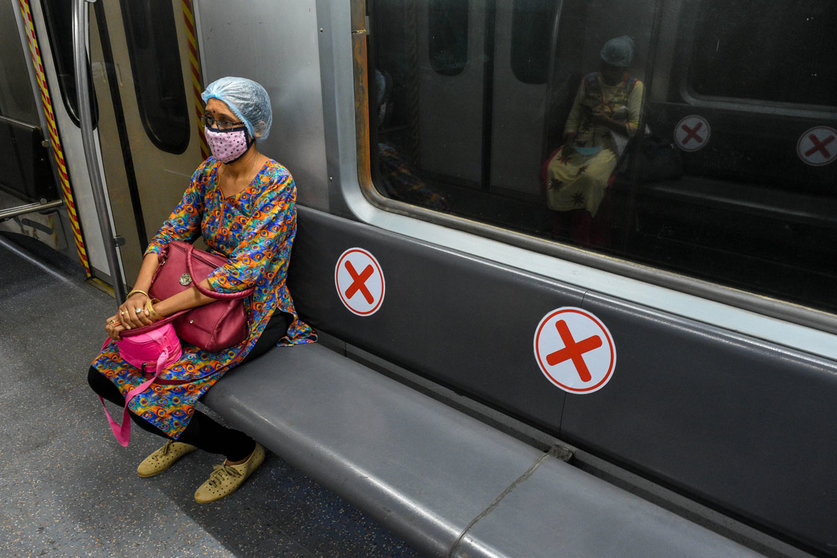 09 September 2020, India, Kolkata: A woman wearing a face mask sits inside a metro car of the Kolkata metro, which prepares to resume full service during the fourth stage easing the coronavirus lockdown. Photo: Debarchan Chatterjee/dpa.