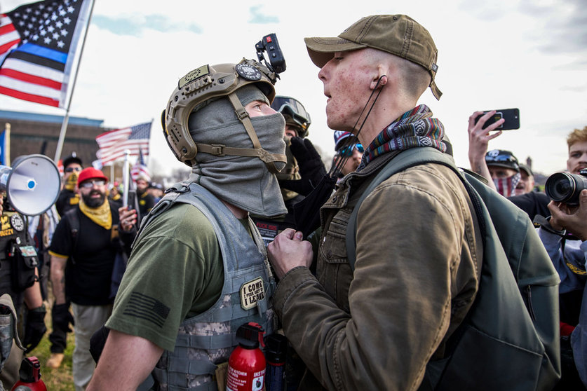 12 December 2020, US, Washington Dc: A member of the the far-right, neo-fascist and male-only political organization "Proud Boys" clashes with another member of the left-wing anti-fascist political movement "Antifa" during a protest in support of President Donald Trump. Photo: Allison Dinner/ZUMA Wire/dpa
