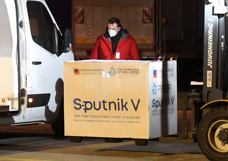 01 March 2021, Slovakia, Kosice: A worker unloads boxes of Sputnik V's Coronavirus vaccine doses from an aircraft upon its arrival from Moscow at Kosice International Airport. Photo: Frantiek Iván/TASR/dpa