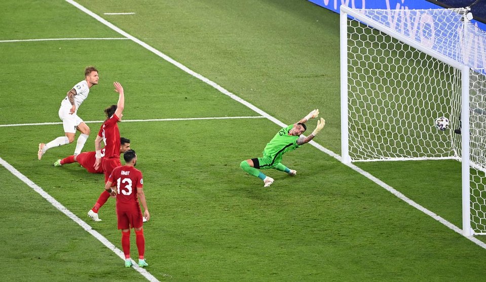 11 June 2021, Italy, Rome: Italy's Ciro Immobile (L) scores his side's seond goal past Turkey goalkeeper Ugurcan Cakir during the UEFA EURO 2020 Group A soccer match between Italy and Turkey at the Olympic Stadium. Photo: Matthias Balk/dpa