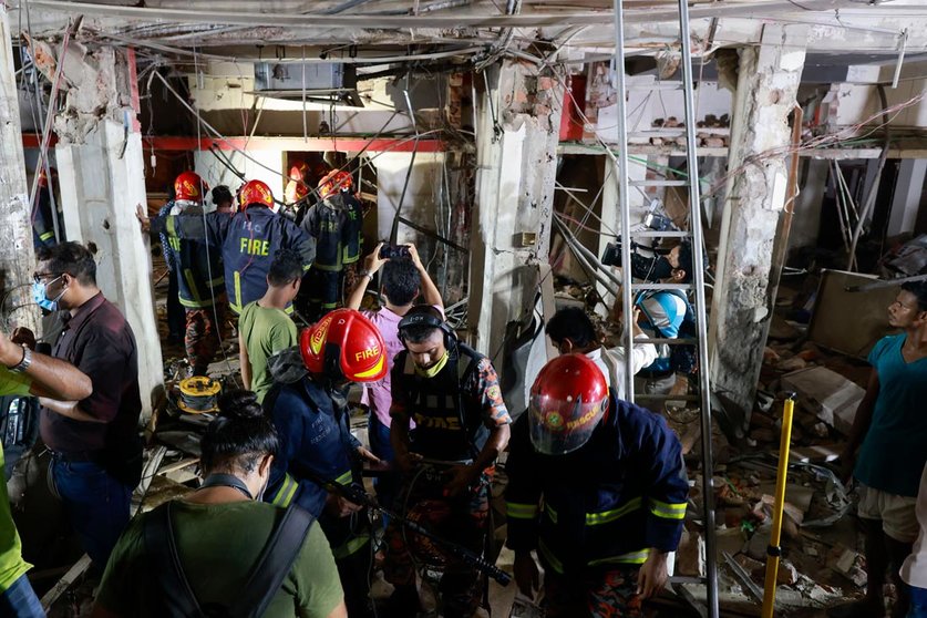 27 June 2021, Bangladesh, Dhaka: Rescue workers inspect the scene after an explosion ripped through a multi-storey building in the Bangladeshi capital, which has killed at least three people and injuring dozens of others. Photo: Suvra Kanti Das/ZUMA Wire/dpa