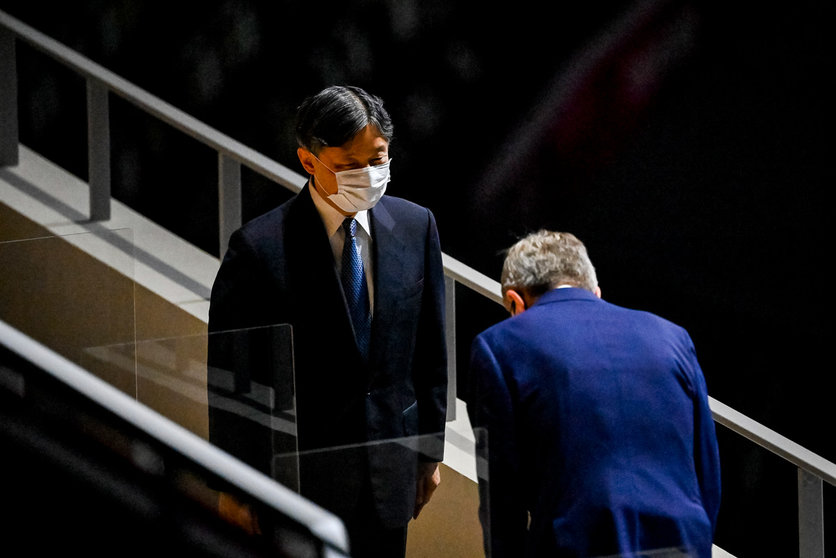 23 July 2021, Japan, Tokyo: Thomas Bach (R), President of the International Olympic Committee (IOC), greets Japan's Emperor Naruhito during the opening ceremony of the Tokyo 2020 Olympic Games at the Olympic Stadium. The ceremony is attended by only 950 VIPs due to the coronavirus pandemic. Photo: Dirk Waem/BELGA/dpa