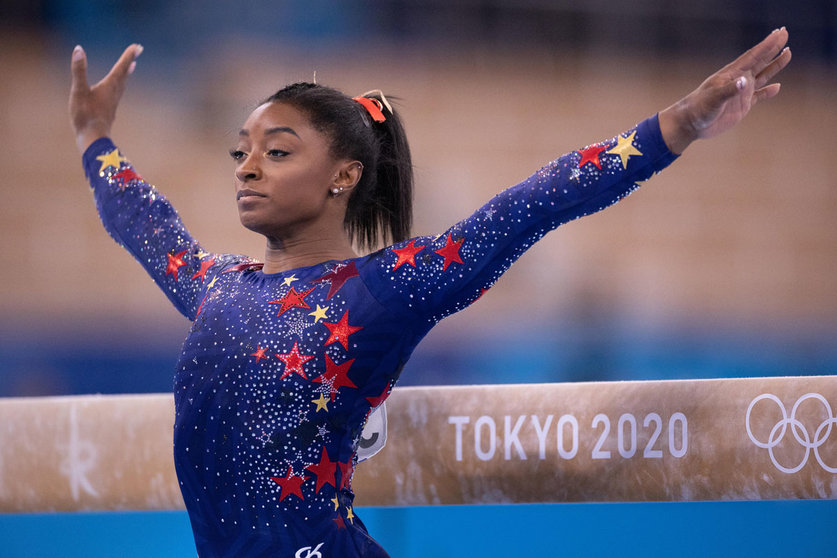 25 July 2021, Japan, Tokyo: USA's Simone Biles reacts after finishing her routine on the balance beam as part of the women's artistic gymnastics qualification at the the Ariake Gymnastics Centre during the Tokyo 2020 Olympic Games. Photo: Paul Kuroda/ZUMA Press Wire/dpa