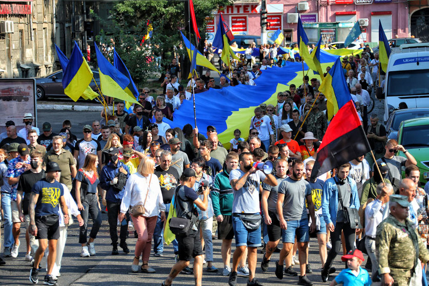 24 August 2021, Ukraine, Odesa: Participants of the March of Defenders of Ukraine move down the city street towards the Heavenly Hundred Square. Photo: -/Ukrinform/dpa