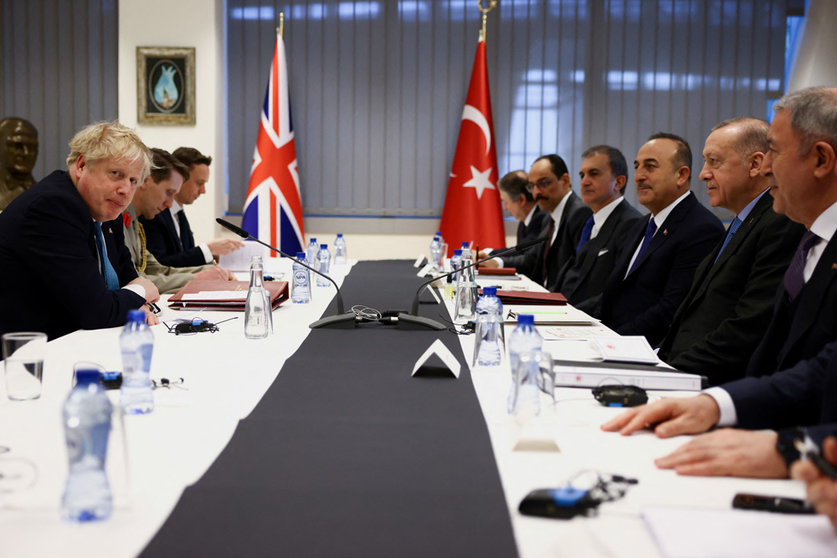24 March 2022, Belgium, Brussels: UK Prime Minister Boris Johnson (L) meets with Turkish President Recep Tayyip Erdogan (2nd R) on teh sidelines of a special meeting of NATO Leaders to discuss Russia's invasion of Ukraine. Photo: Henry Nicholls/PA Wire/dpa.