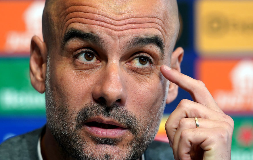 25 April 2022, United Kingdom, Manchester: Manchester City manager Pep Guardiola speaks during a press conference at the City Football Academy ahead of Tuesday's UEFA Champions League semi-final first leg soccer match against Real Madrid. Photo: Martin Rickett/PA Wire/dpa.
