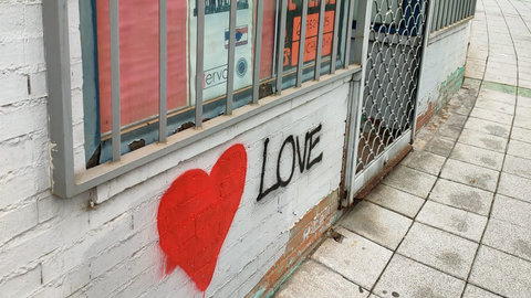 Graffiti red heart on a wall. Photo: Matthew Kennington.